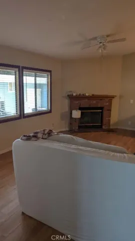 a living room with furniture and a piano