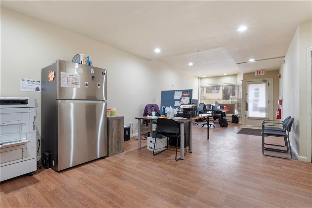 2114 Broadway Avenue Pittsburgh, PA 15216 - Photo 13 of 24 a living room with furniture and a refrigerator