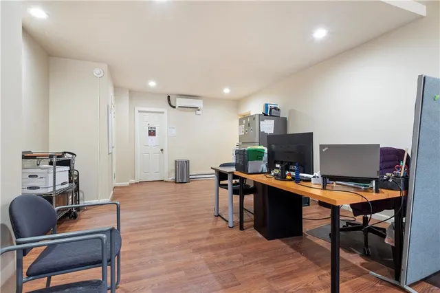 a workspace with furniture and wooden floor