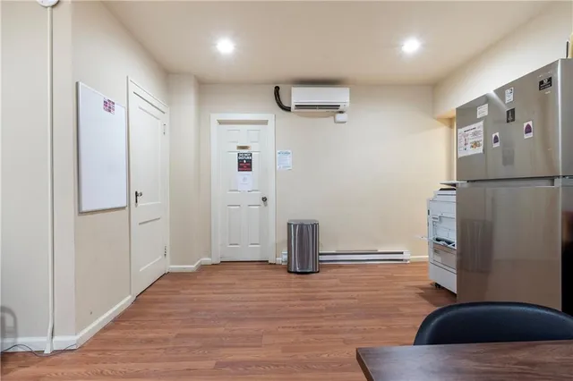 a view of a workspace with furniture and a workspace