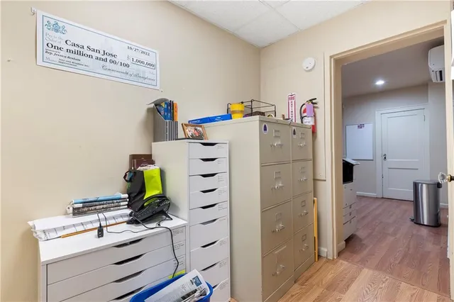 a room with a chair and gym equipment