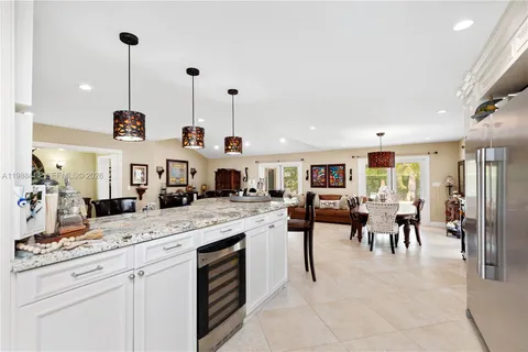 a view of living room and kitchen with furniture