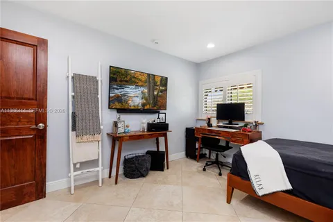 a workspace with furniture and flat screen tv