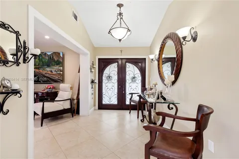 a view of a livingroom with furniture and a large window