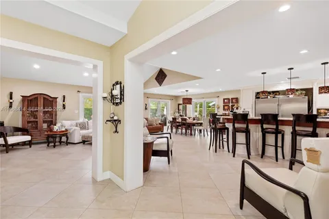 a view of a lobby with furniture and a dining table