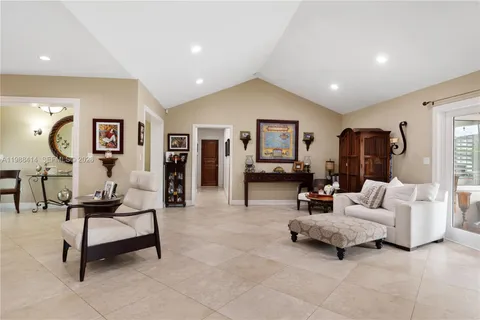 a living room with furniture and a mirror