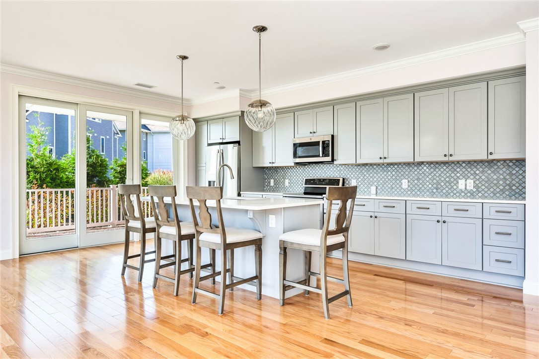 1 Compass Way, Unit 101 Westerly, RI 02891 - Photo 4 of 27 A beautifully appointed kitchen with shaker cabinets
