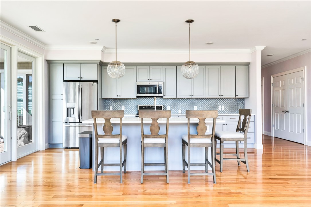 1 Compass Way, Unit 101 Westerly, RI 02891 - Photo 5 of 27 There is an ample island that allows eat in dining.
