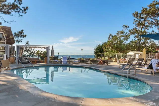 a view of a swimming pool with a sitting area