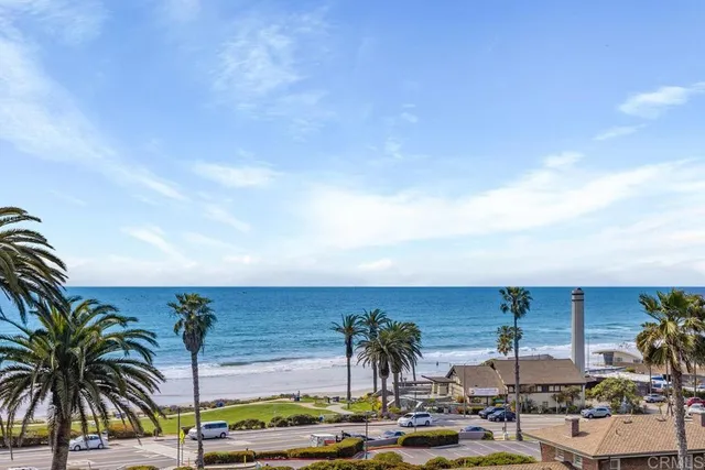 a view of multiple houses with outdoor space