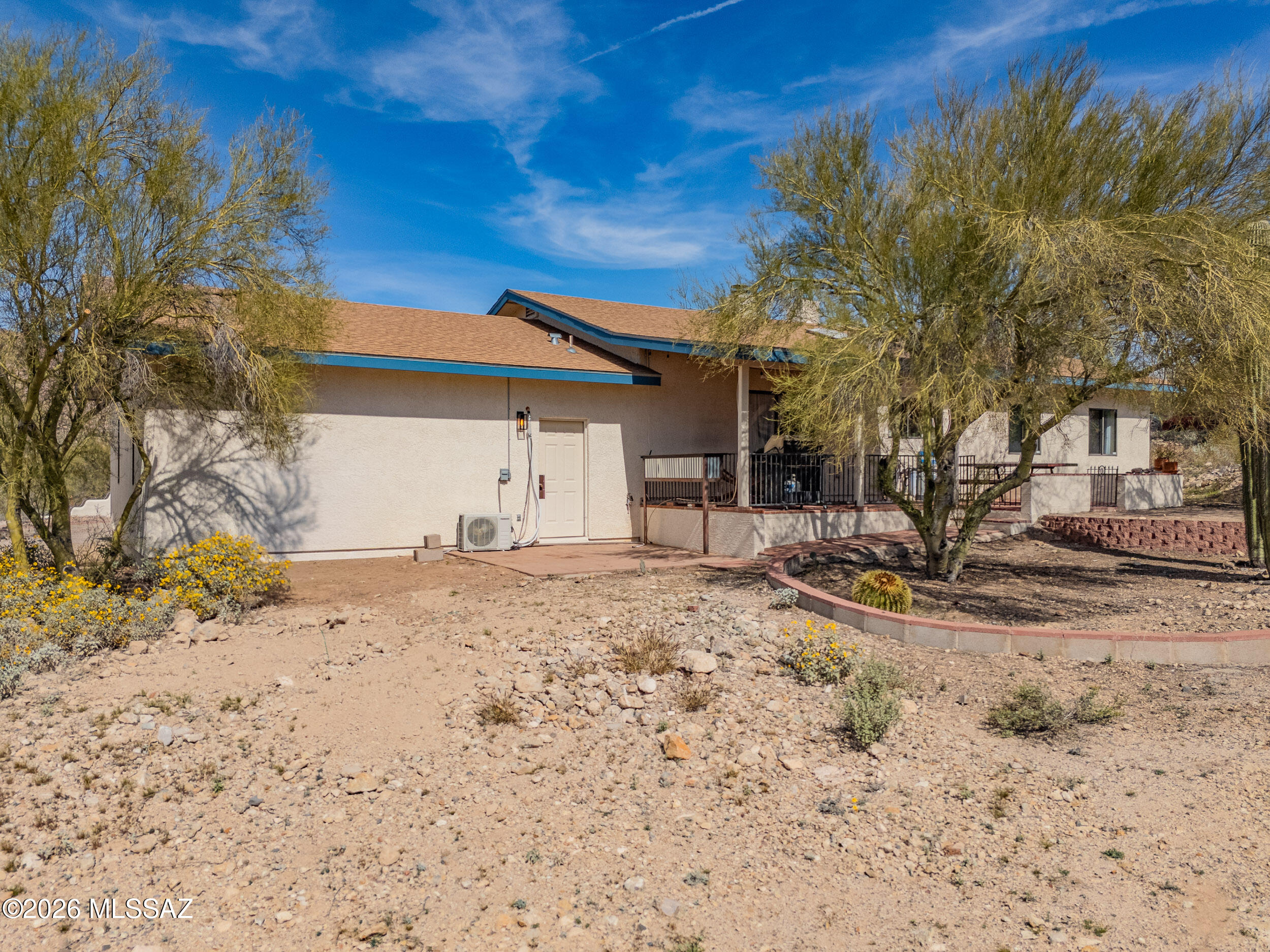 4155 West Coyote Ridge Trail Tucson, AZ 85746 - Photo 6 of 39 a view of a yard with a tree