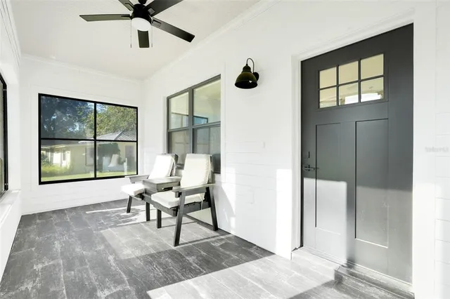 a work room with windows and ceiling fan