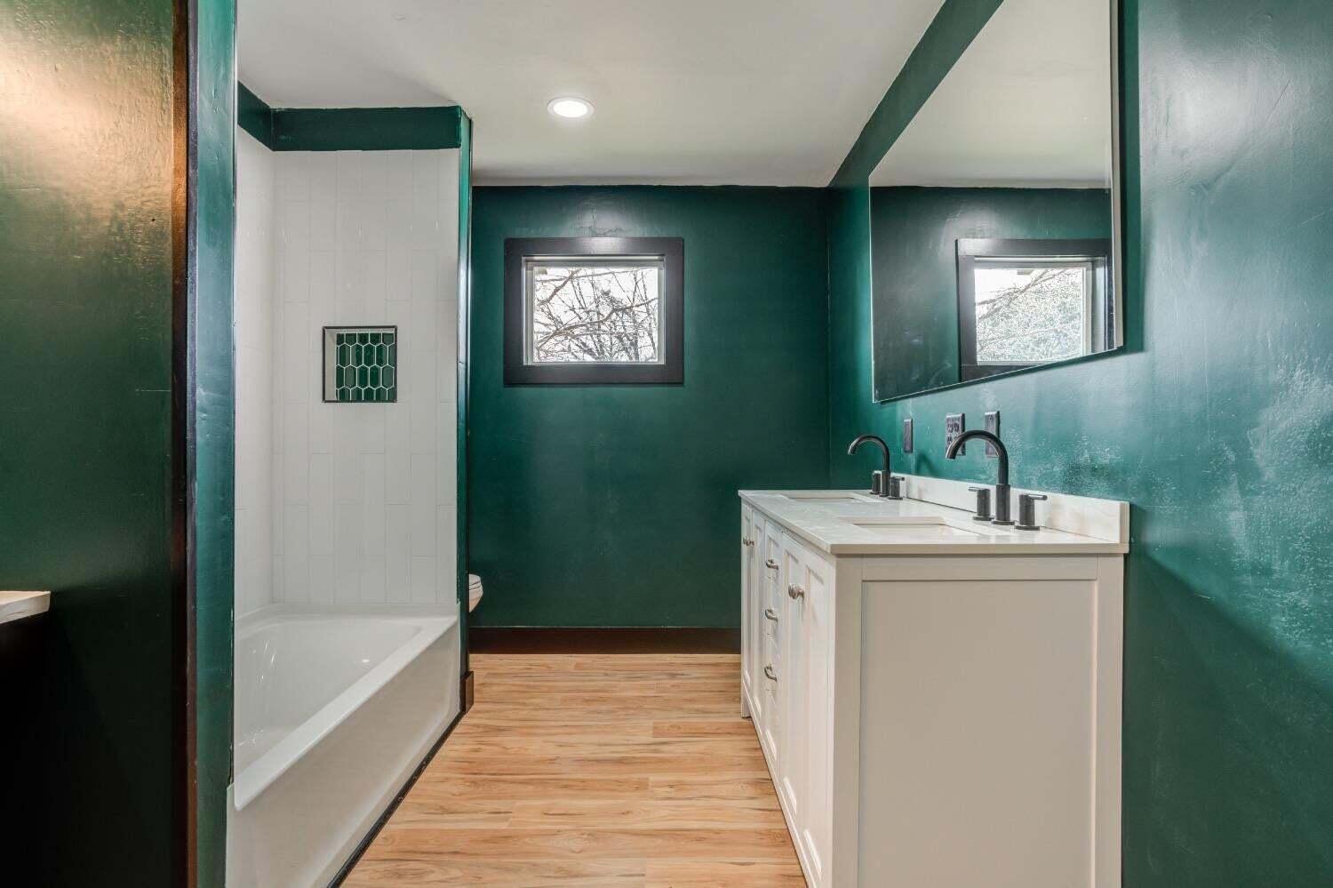 3410 40th Street Lubbock, TX 79413 - Photo 18 of 29 a bathroom with a sink and a mirror