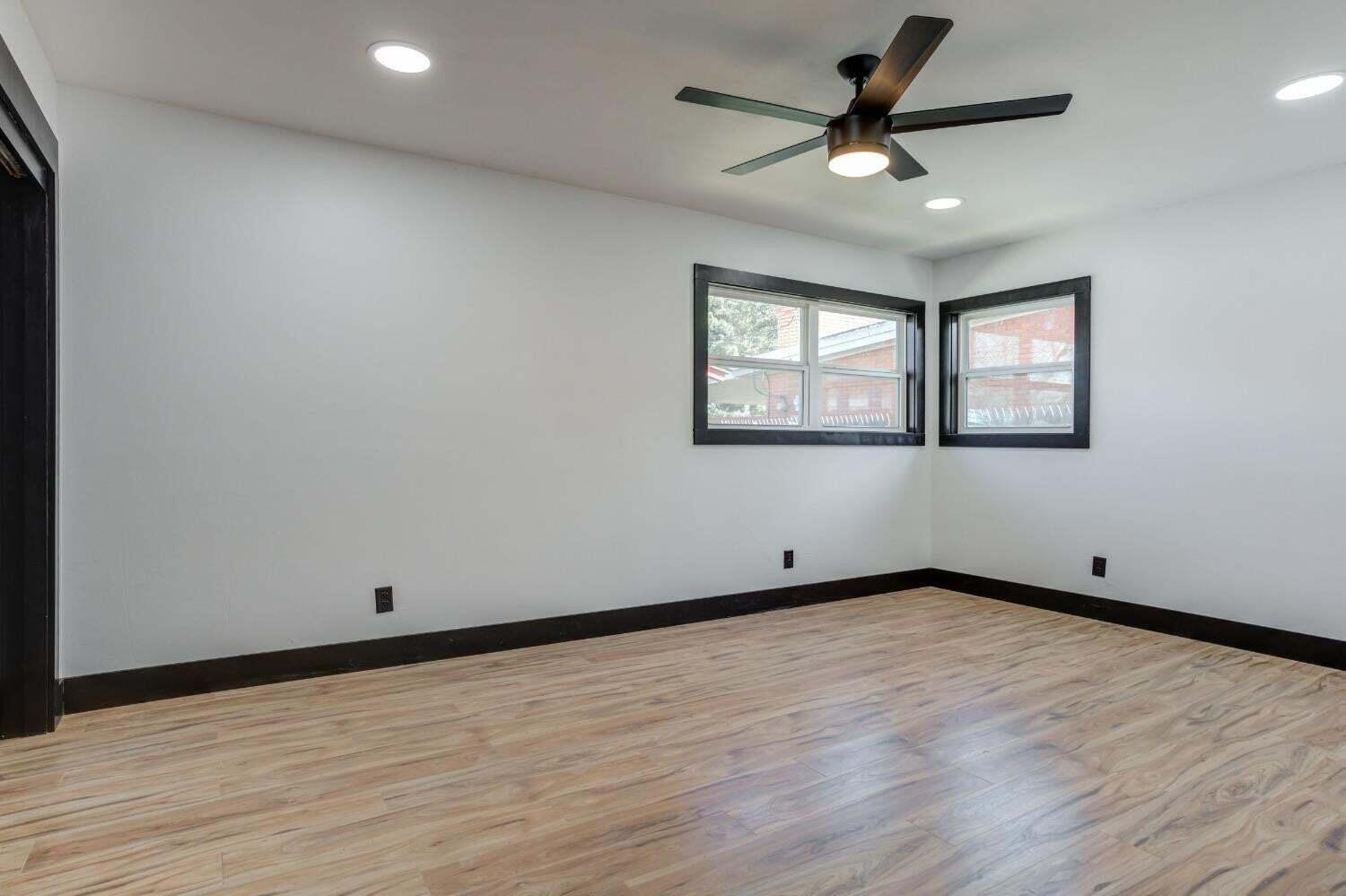 3410 40th Street Lubbock, TX 79413 - Photo 24 of 29 wooden floor in an empty room with a window