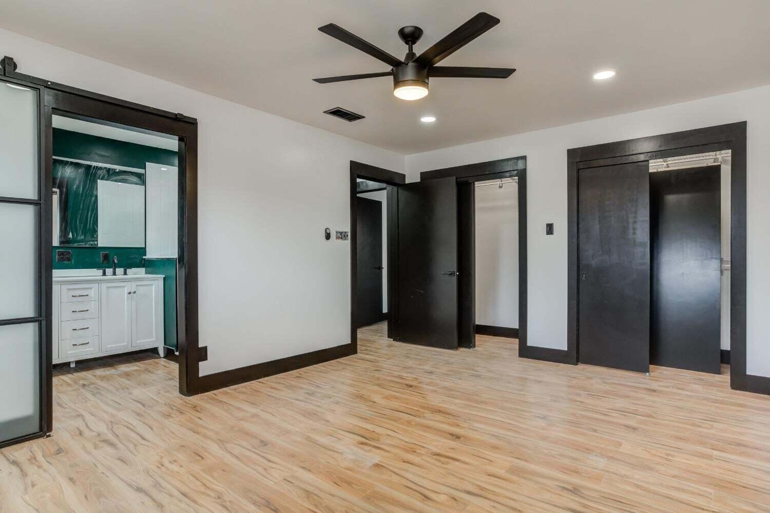 3410 40th Street Lubbock, TX 79413 - Photo 26 of 29 a view of empty room with wooden floor and ceiling fan