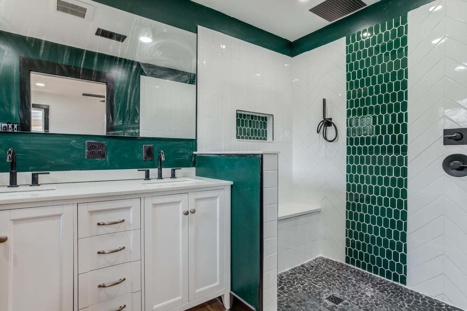 3410 40th Street Lubbock, TX 79413 - Photo 28 of 29 a bathroom with a sink and a mirror