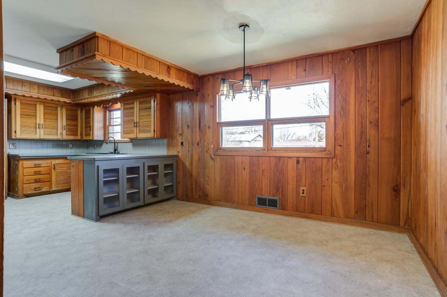 3410 40th Street Lubbock, TX 79413 - Photo 9 of 29 an empty room with windows and ceiling fan