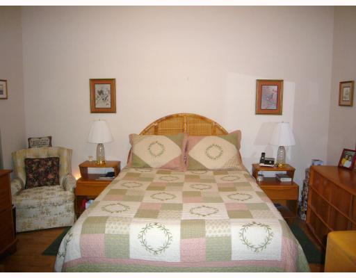 5000 Southwest 198th Terrace Southwest Ranches, FL 33332 - Photo 13 of 16 a bedroom with a bed and a table in it