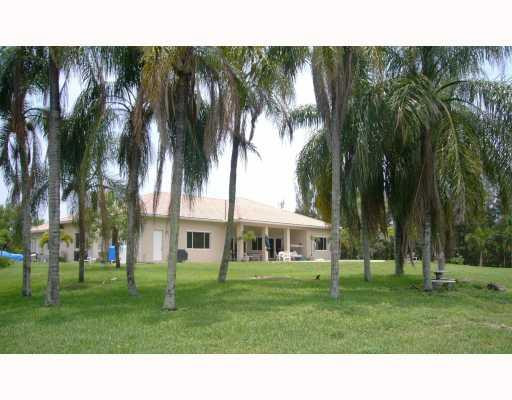5000 Southwest 198th Terrace Southwest Ranches, FL 33332 - Photo 16 of 16 a black and white house with a yard