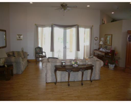 5000 Southwest 198th Terrace Southwest Ranches, FL 33332 - Photo 2 of 16 a living room with couches and kitchen view with wooden floor