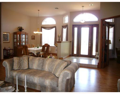 5000 Southwest 198th Terrace Southwest Ranches, FL 33332 - Photo 3 of 16 a living room with furniture and a chandelier