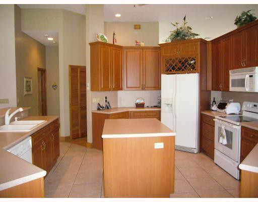 5000 Southwest 198th Terrace Southwest Ranches, FL 33332 - Photo 4 of 16 a kitchen with stainless steel appliances granite countertop a refrigerator a stove a sink and a microwave