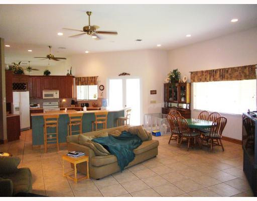 5000 Southwest 198th Terrace Southwest Ranches, FL 33332 - Photo 8 of 16 a living room with furniture kitchen view and a large window
