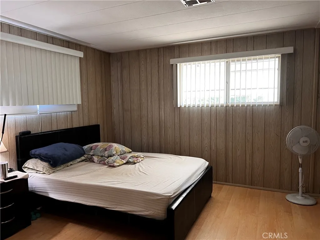 12101 Dale Stanton Ca, Unit 69 Stanton, CA 90680 - Photo 5 of 5 a bedroom with a bed and a window