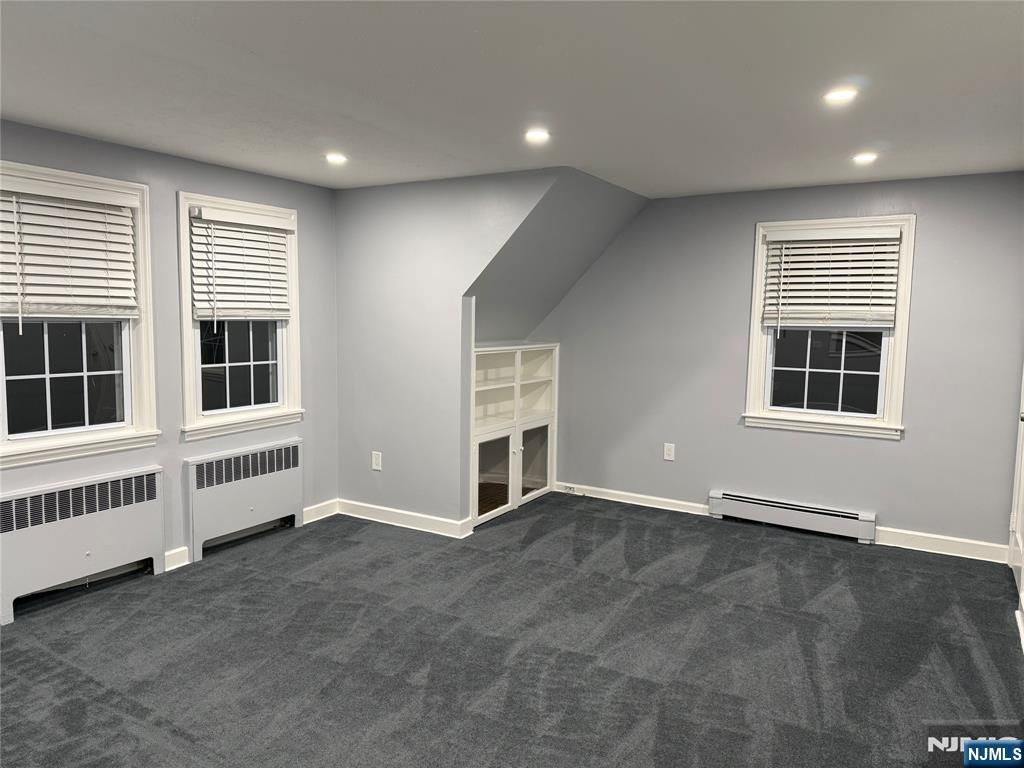 9 B Cottage Lane, Unit B Upper Saddle River, NJ 07458 - Photo 6 of 13 an empty room with windows