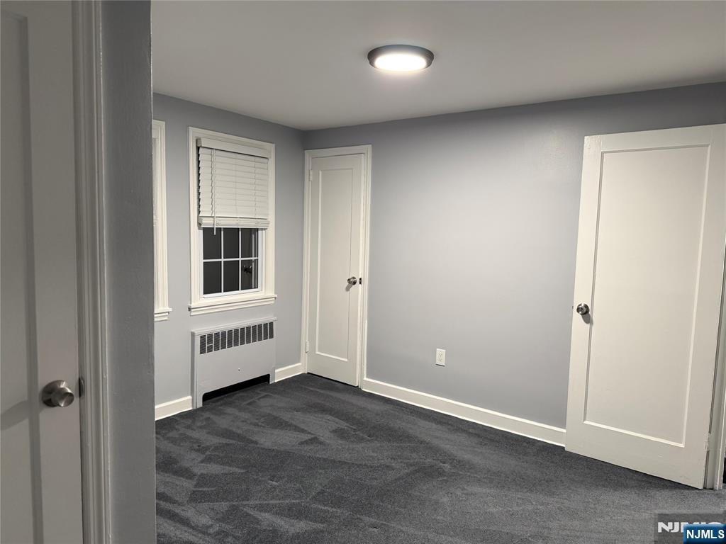 9 B Cottage Lane, Unit B Upper Saddle River, NJ 07458 - Photo 9 of 13 an empty room with windows