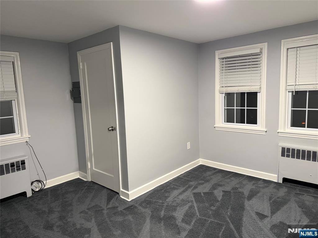 9 B Cottage Lane, Unit B Upper Saddle River, NJ 07458 - Photo 10 of 13 an empty room with windows