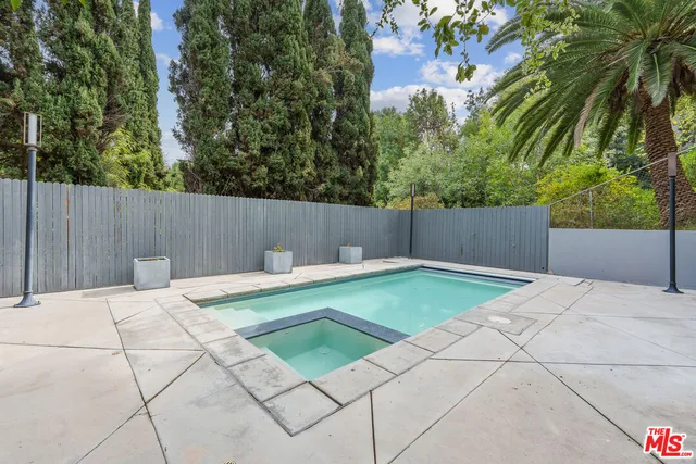 a view of a patio with chairs and a table and chairs