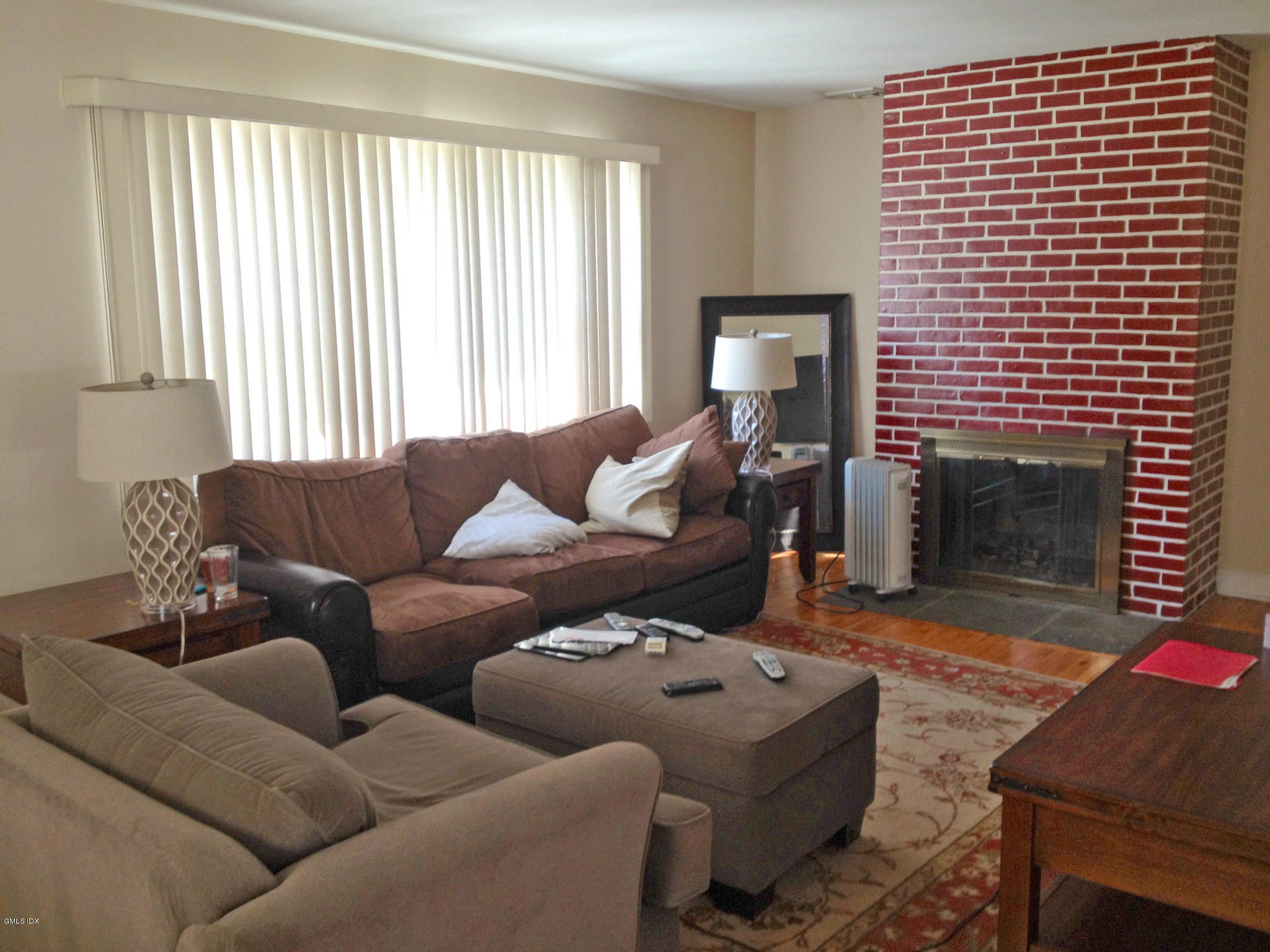 19 Wescott Street Riverside, CT 06878 - Photo 2 of 13 a living room with furniture and a fireplace