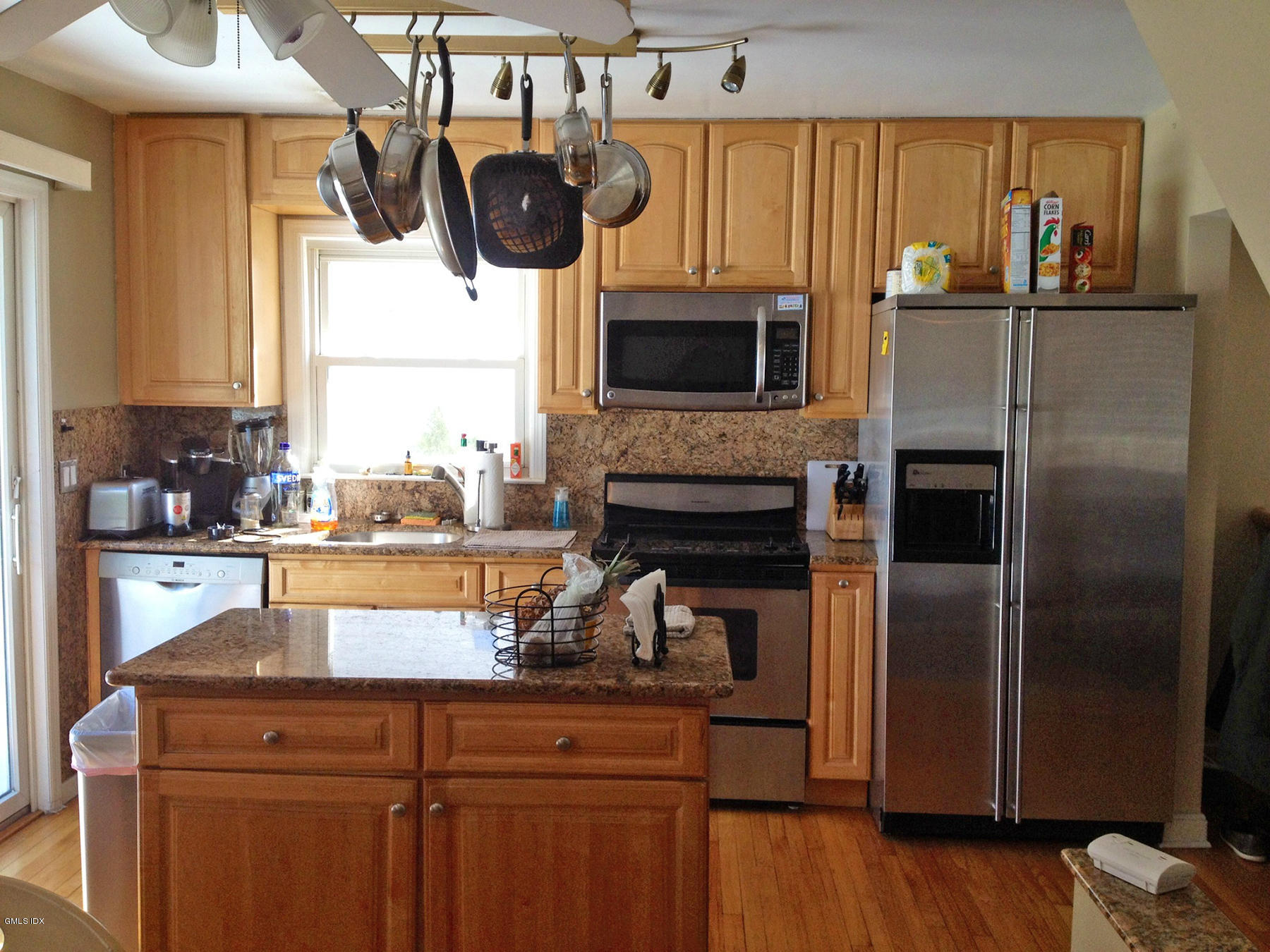 19 Wescott Street Riverside, CT 06878 - Photo 3 of 13 a kitchen with a refrigerator and a stove top oven