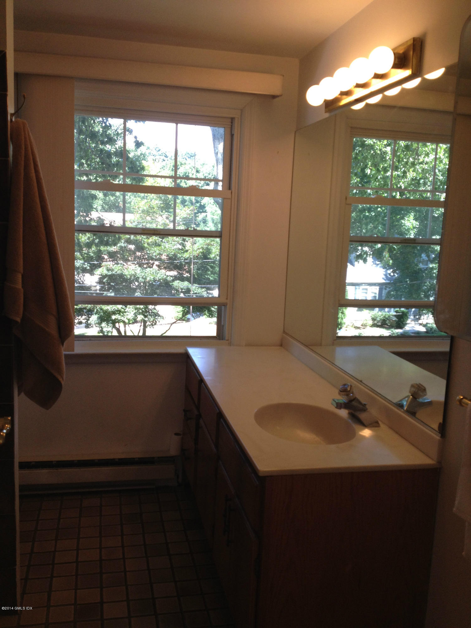 19 Wescott Street Riverside, CT 06878 - Photo 7 of 13 a bathroom with a sink vanity and a mirror