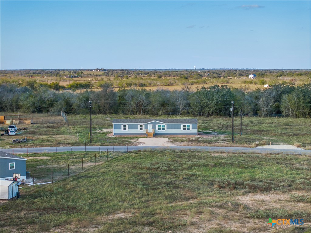 139 Azalea Ct Dale Dale, TX 78616 - Photo 1 of 26 a view of a field with ocean view