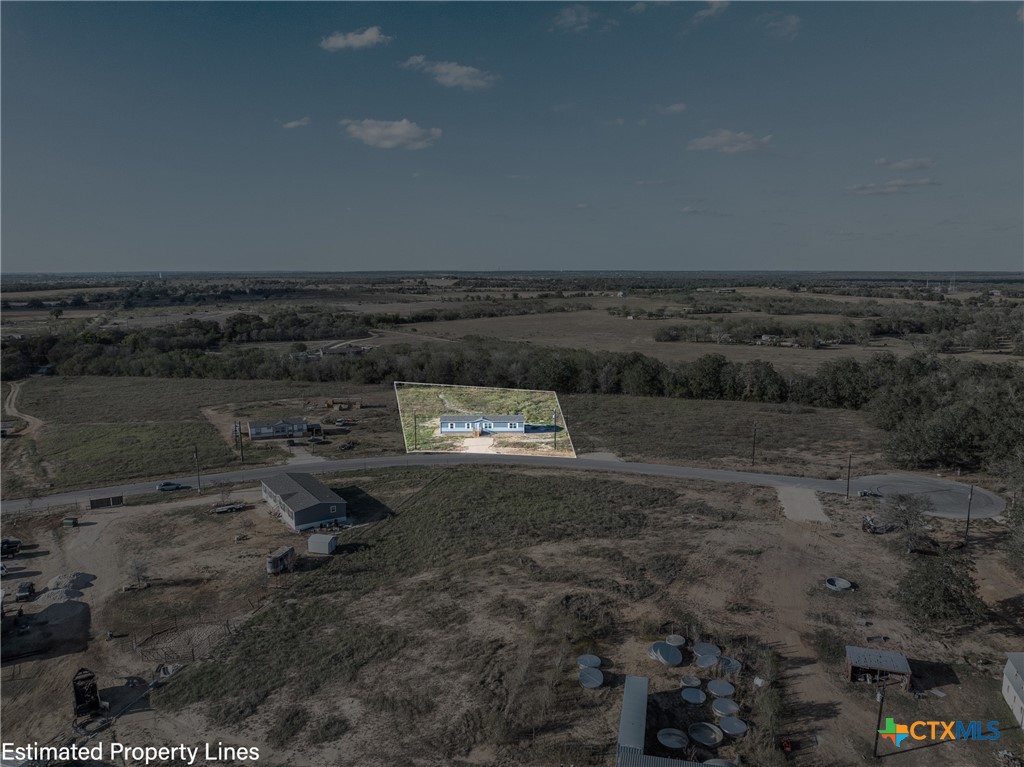 139 Azalea Ct Dale Dale, TX 78616 - Photo 12 of 26 a view of a dry yard with wooden floor