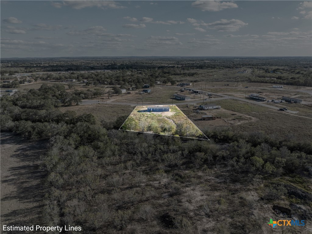 139 Azalea Ct Dale Dale, TX 78616 - Photo 13 of 26 a view of a dry yard