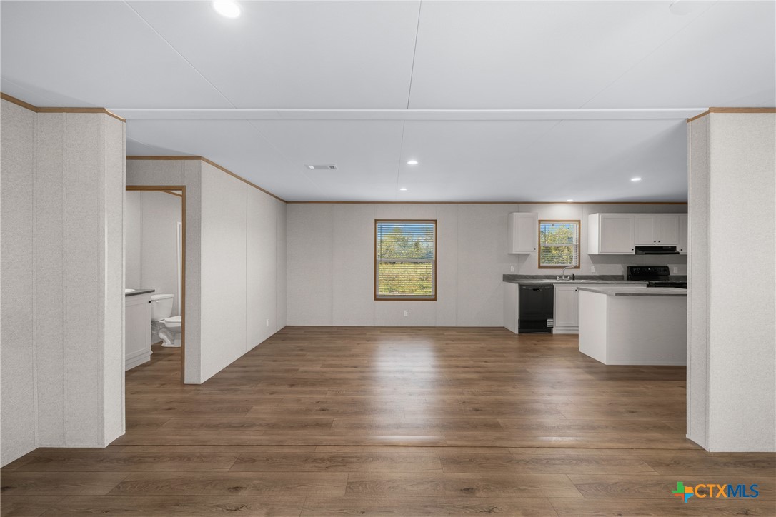 139 Azalea Ct Dale Dale, TX 78616 - Photo 6 of 26 a view of kitchen view wooden floor and appliances