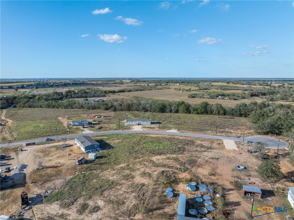 139 Azalea Ct Dale Dale, TX 78616 - Photo 7 of 26 a view of a lake with a city