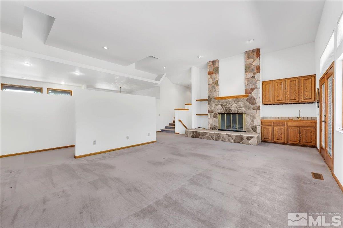 4285 Bitteroot Road Reno, NV 89519 - Photo 11 of 40 a view of a livingroom with furniture and a ceiling fan