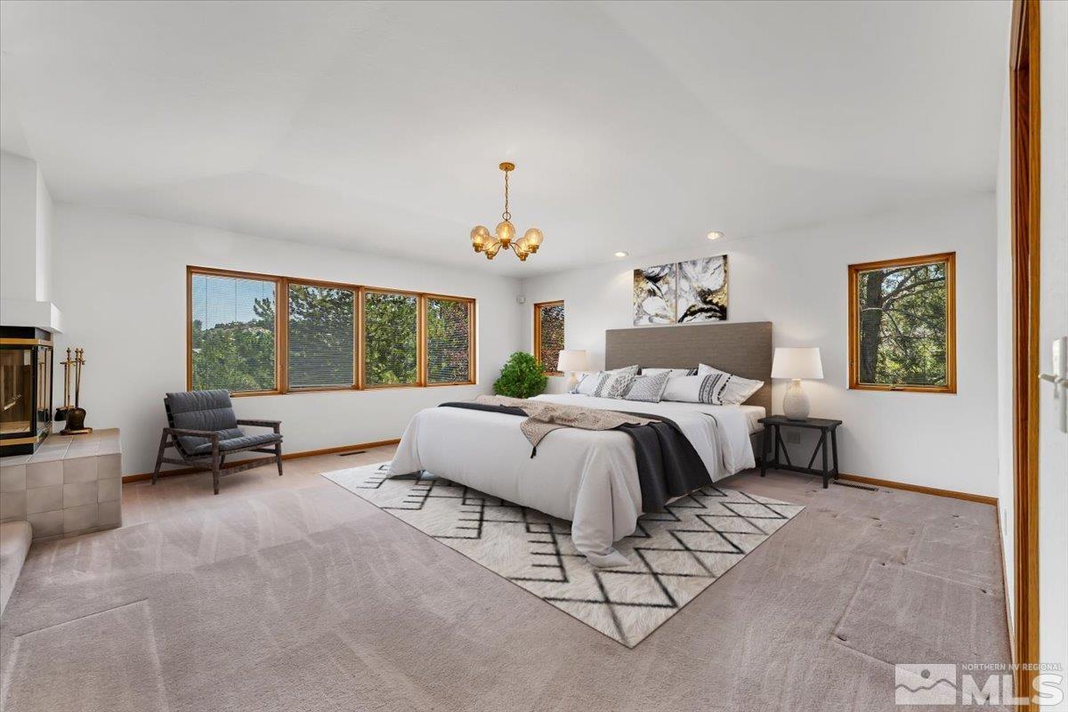 4285 Bitteroot Road Reno, NV 89519 - Photo 18 of 40 a spacious bedroom with a bed and a large window
