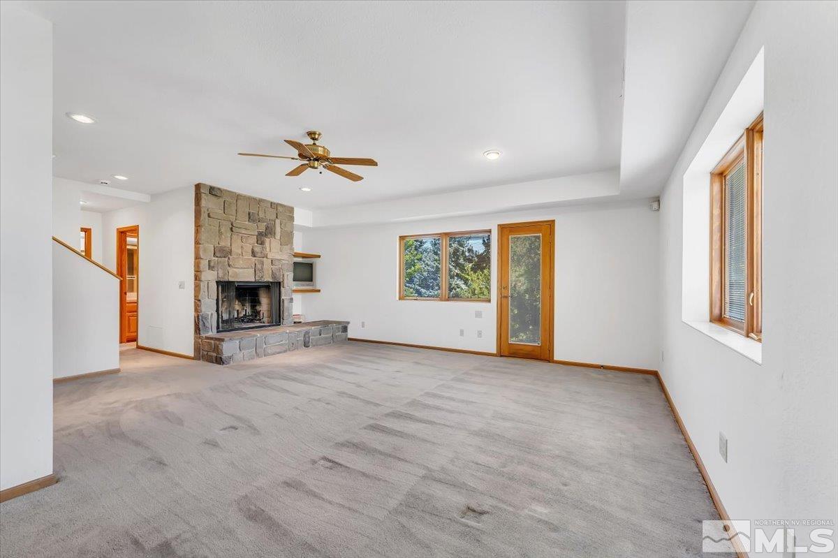 4285 Bitteroot Road Reno, NV 89519 - Photo 25 of 40 an empty room with windows and fireplace