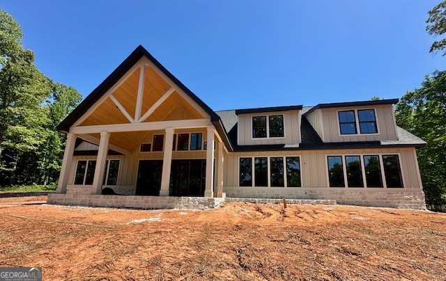 106 Equestrian Drive Forsyth, GA 31029 - Photo 15 of 52 a front view of a house with a yard