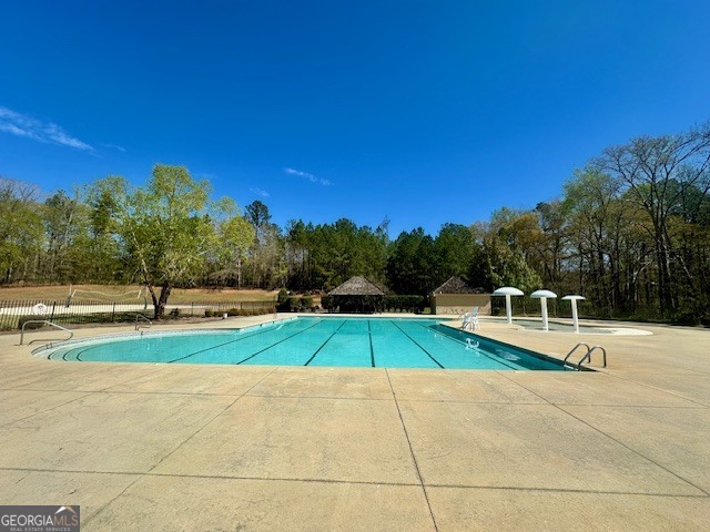 106 Equestrian Drive Forsyth, GA 31029 - Photo 24 of 52 a view of a backyard with swimming pool