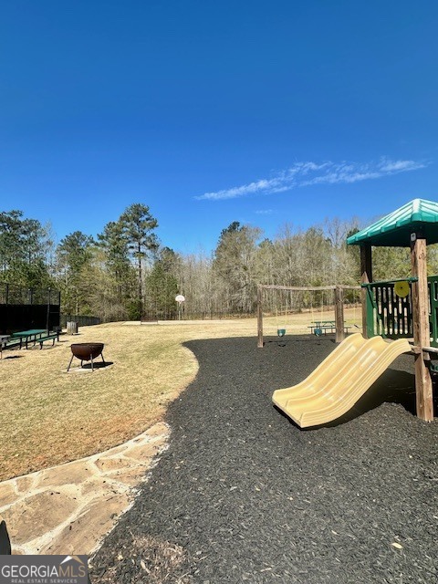 106 Equestrian Drive Forsyth, GA 31029 - Photo 31 of 52 a view of swimming pool with a yard