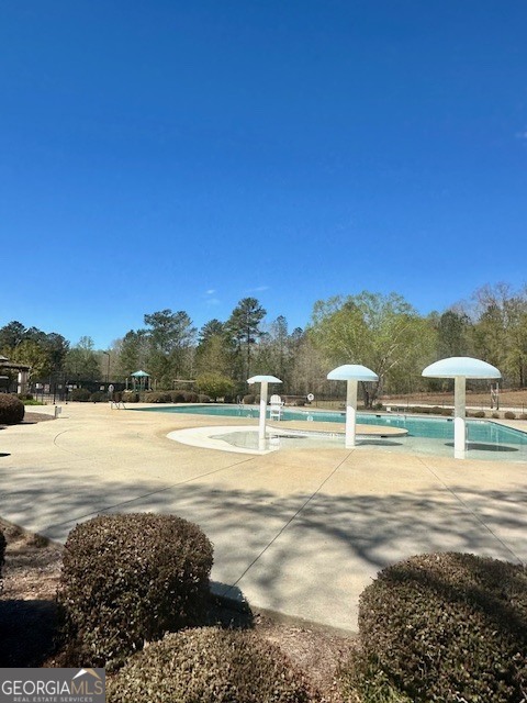 106 Equestrian Drive Forsyth, GA 31029 - Photo 34 of 52 a view of an ocean and beach