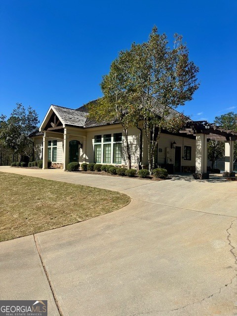 106 Equestrian Drive Forsyth, GA 31029 - Photo 35 of 52 a front view of a house with a yard