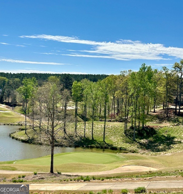 106 Equestrian Drive Forsyth, GA 31029 - Photo 37 of 52 a view of a swimming pool with an ocean view