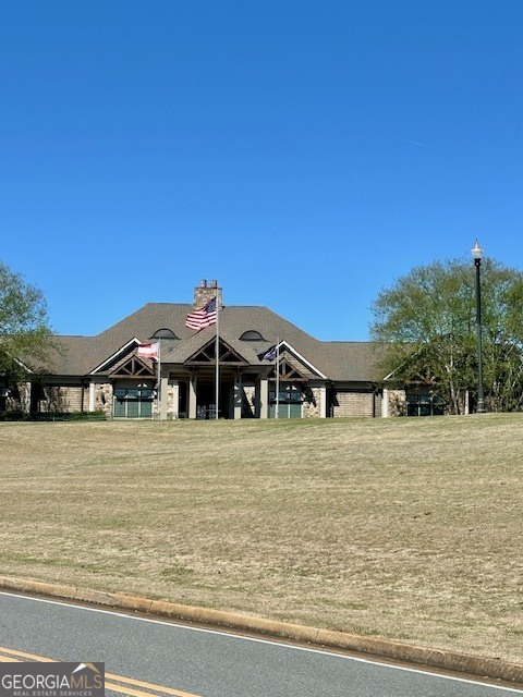 106 Equestrian Drive Forsyth, GA 31029 - Photo 38 of 52 a front view of a house with a yard